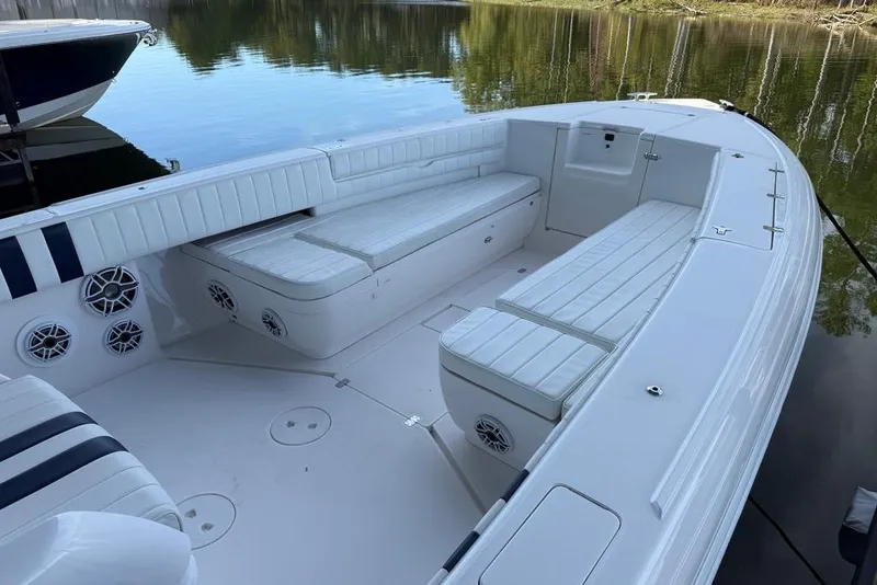 Slide: The Image of 2005 Intrepid 370 Center Console boat with spacious seating on calm water. - 12