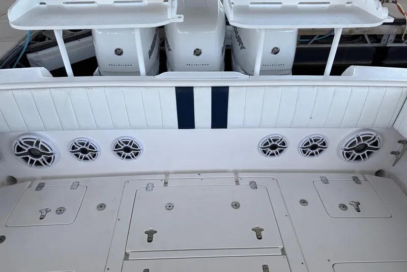 Slide: The Image of 2005 Intrepid 370 Center Console boat with multiple speakers and storage compartments. - 16