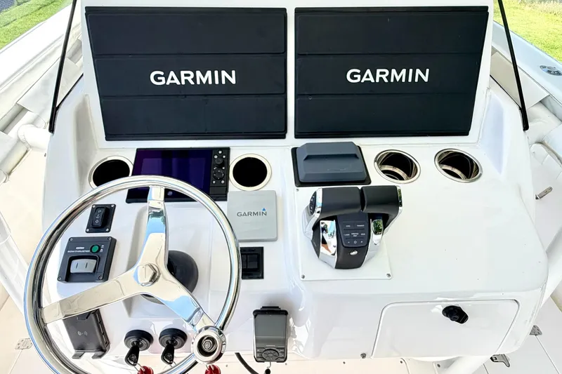 Slide: The Image of 2005 Intrepid 370 Center Console helm with Garmin displays and steering wheel. - 20