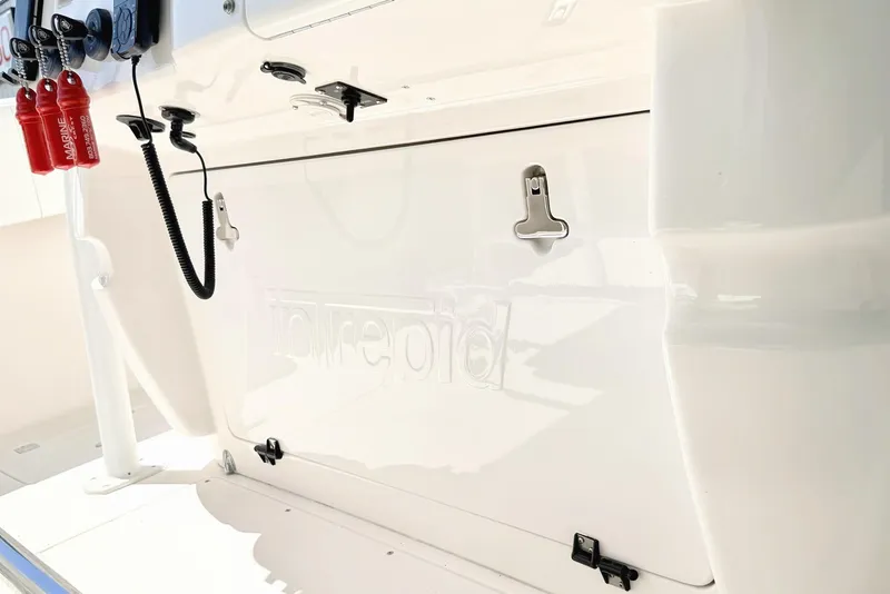 Slide: The Image of 2005 Intrepid 370 Center Console boat interior with safety equipment and storage compartment. - 21