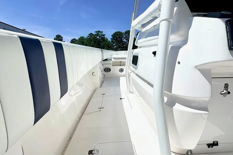 Slide: The Image of 2005 Intrepid 370 Center Console boat interior with white and blue seating. - 23