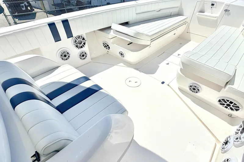 Slide: The Image of 2005 Intrepid 370 Center Console boat interior with white and blue seating. - 25