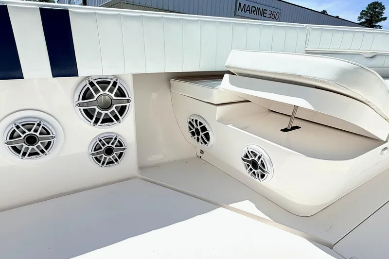 Slide: The Image of 2005 Intrepid 370 Center Console boat interior with speakers and seating. - 28