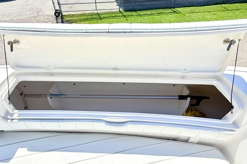 Slide: The Image of Open storage compartment on a 2005 Intrepid 370 Center Console boat. - 31