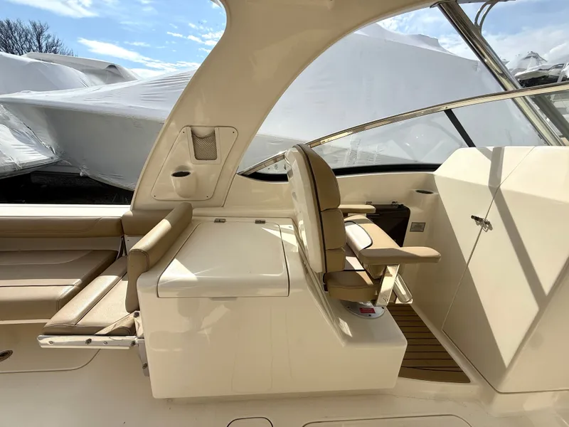 Slide: The Image of Interior of a 2015 Scout 275 Dorado boat with seating area. - 11