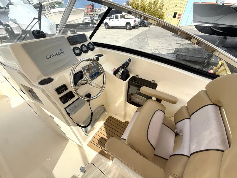 Slide: The Image of Interior view of 2015 Scout 275 Dorado with Garmin controls. - 15