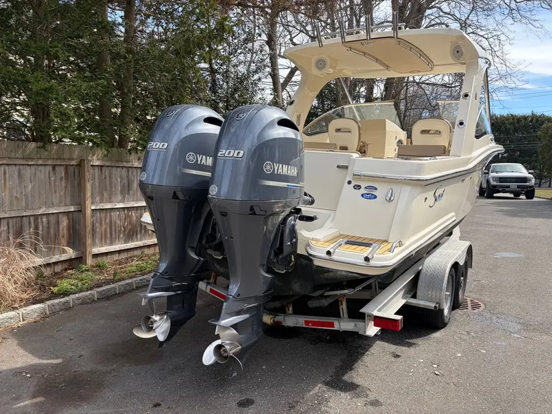 Slide: The Image of Scout 275 Dorado 2015 with Yamaha engines on trailer. - 2