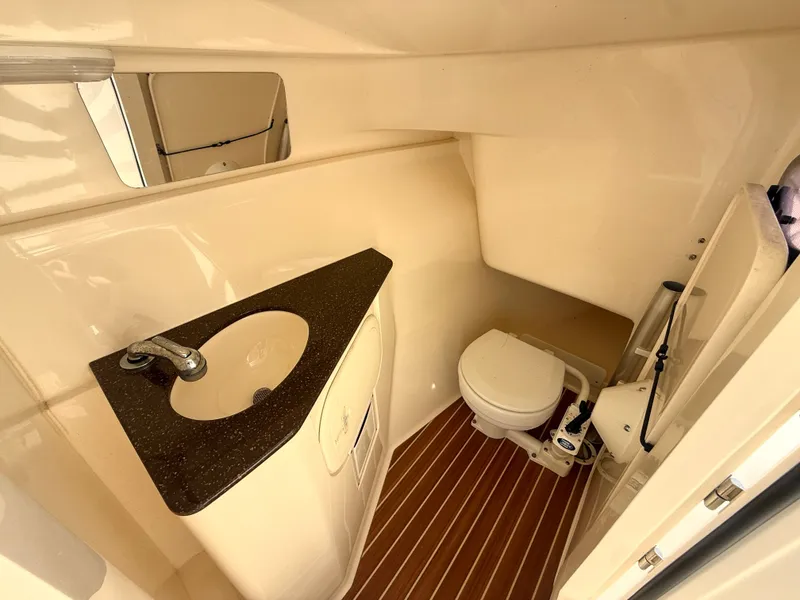 Slide: The Image of Interior of 2015 Scout 275 Dorado featuring sink and toilet. - 22