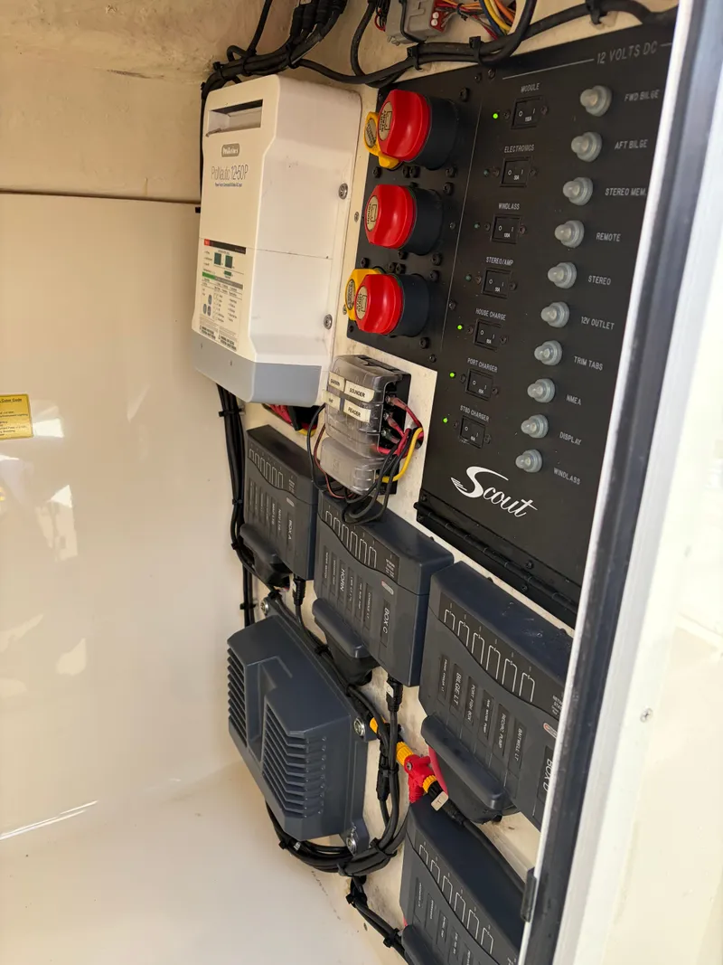 Slide: The Image of Electrical panel of a 2015 Scout 275 Dorado boat. - 28