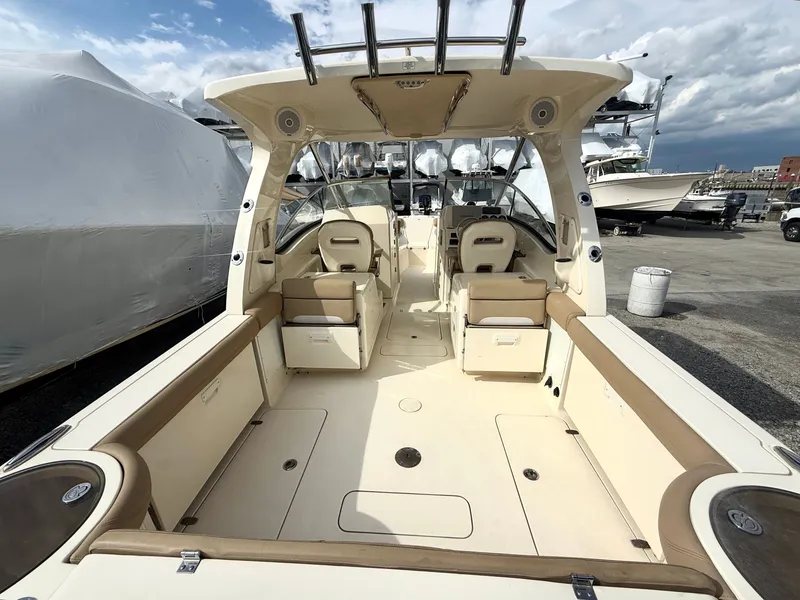 Slide: The Image of Interior view of a 2015 Scout 275 Dorado boat at the marina. - 5