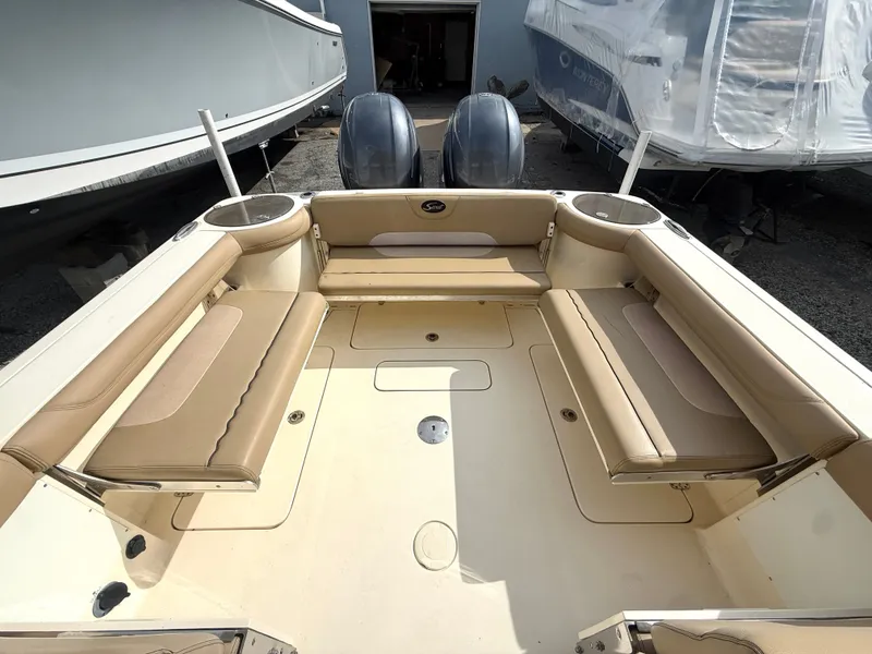 Slide: The Image of Interior of a 2015 Scout 275 Dorado boat with beige seating. - 7