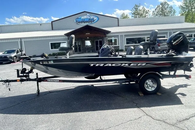 The Image of 2022 Tracker Pro Team 175 TF boat on trailer outside dealership. - 1