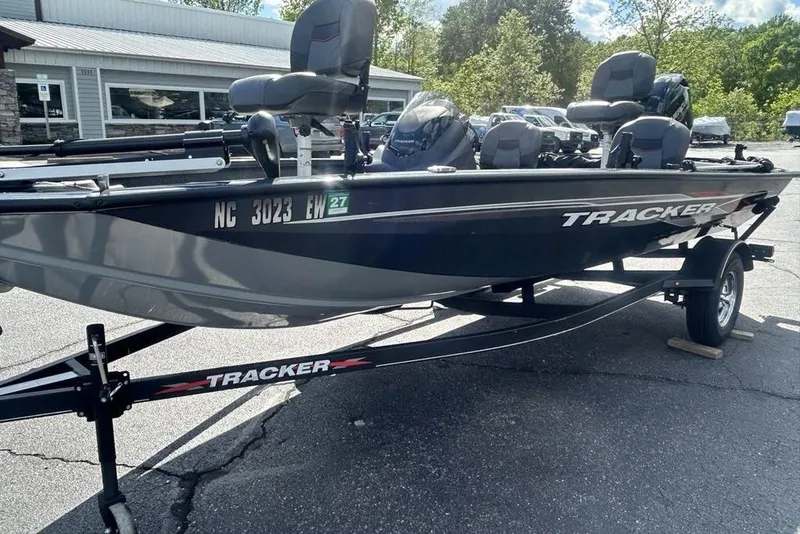 Slide: The Image of 2022 Tracker Pro Team 175 TF fishing boat on trailer, parked outdoors. - 10