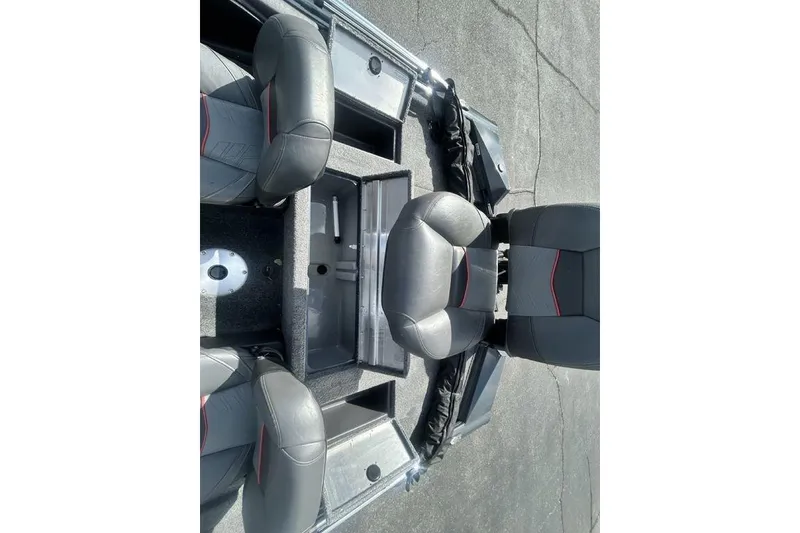 Slide: The Image of 2022 Tracker Pro Team 175 TF boat interior with seating and storage compartments. - 14