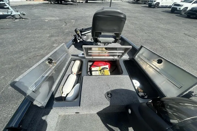 Slide: The Image of 2022 Tracker Pro Team 175 TF boat with open storage compartments and seating. - 15