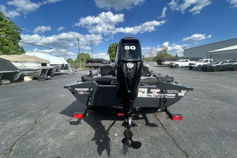 Slide: The Image of 2022 Tracker Pro Team 175 TF boat with 60 HP engine in parking lot. - 16