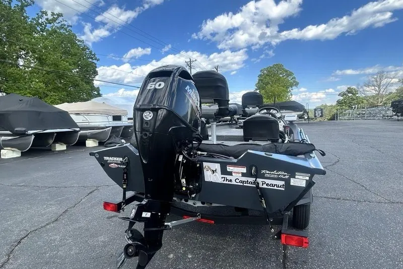Slide: The Image of 2022 Tracker Pro Team 175 TF boat with Mercury 60 engine, parked outdoors. - 20