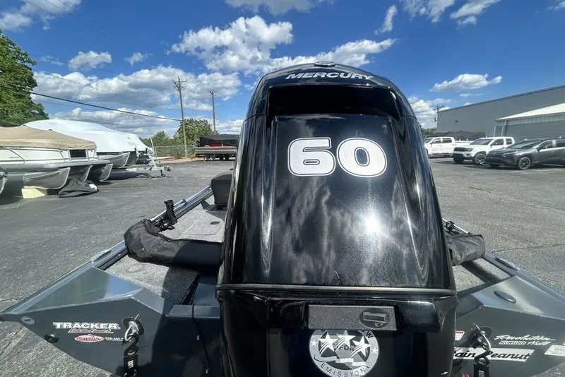 Slide: The Image of 2022 Tracker Pro Team 175 TF boat with Mercury 60 engine in parking lot. - 22