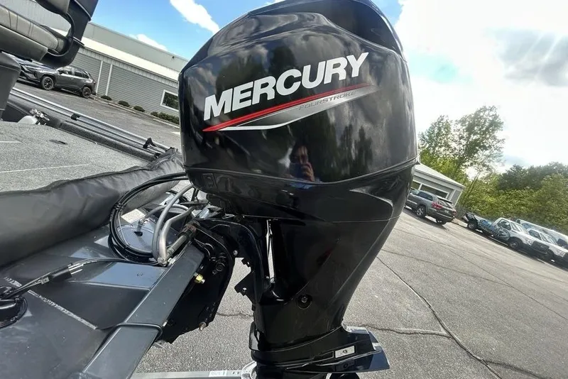 Slide: The Image of Mercury outboard motor on 2022 Tracker Pro Team 175 TF boat, parked outdoors. - 4