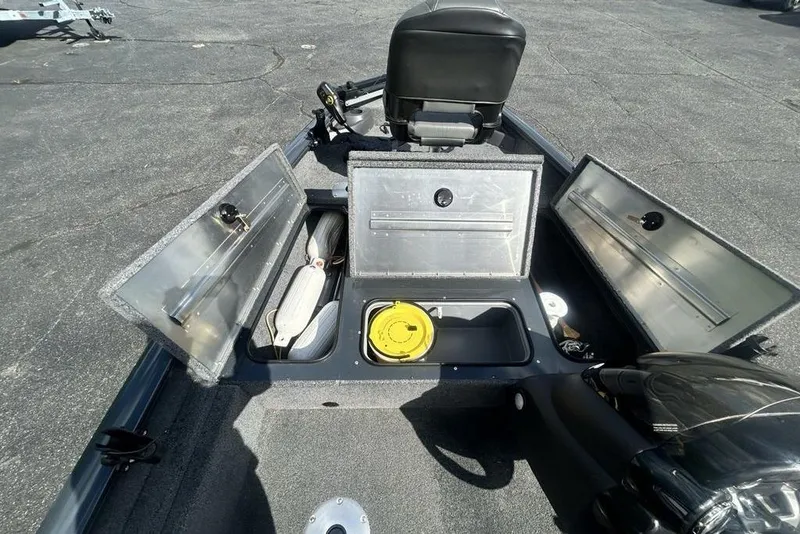 Slide: The Image of 2022 Tracker Pro Team 175 TF boat interior with open storage compartments. - 9