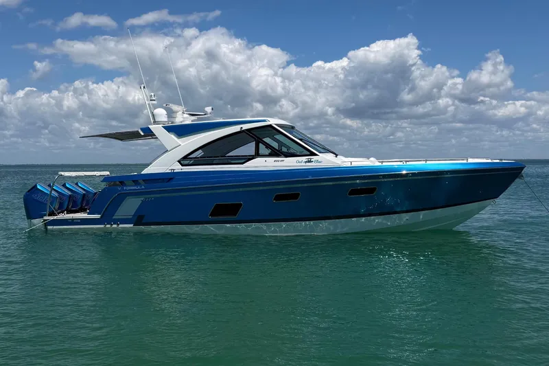 The Image of 2024 Formula 400 Super Sport Crossover boat on calm ocean under blue sky. - 0