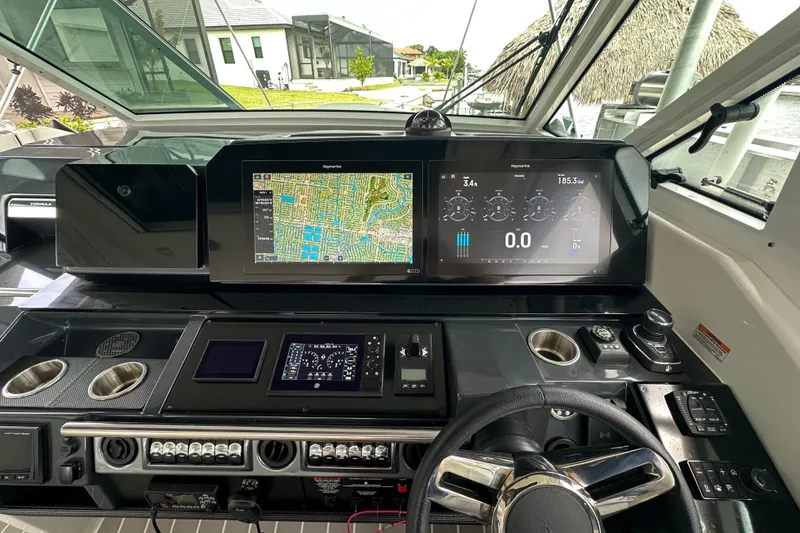 Slide: The Image of 2024 Formula 400 Super Sport Crossover dashboard with navigation and control displays. - 12