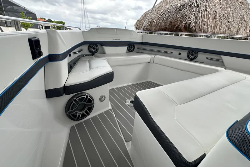 Slide: The Image of 2024 Formula 400 Super Sport Crossover boat interior with sleek white seating and modern design. - 16