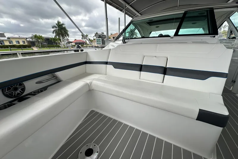 Slide: The Image of 2024 Formula 400 Super Sport Crossover boat interior with sleek white seating and modern design. - 18
