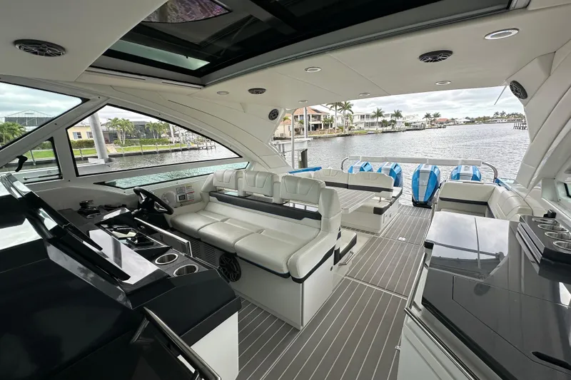 Slide: The Image of 2024 Formula 400 Super Sport Crossover luxury yacht interior with sleek design and waterfront view. - 19