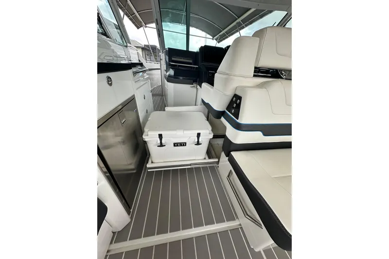 Slide: The Image of 2024 Formula 400 Super Sport Crossover interior with seating and Yeti cooler. - 28