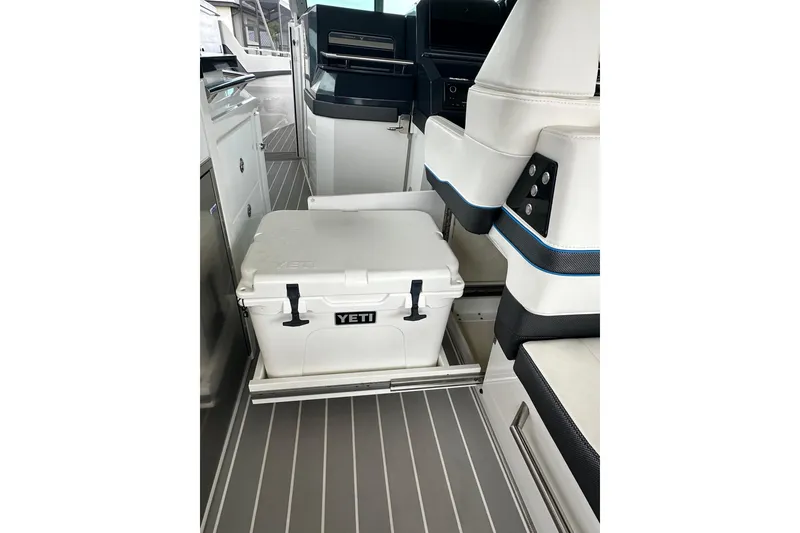 Slide: The Image of 2024 Formula 400 Super Sport Crossover interior with Yeti cooler on sliding tray. - 29