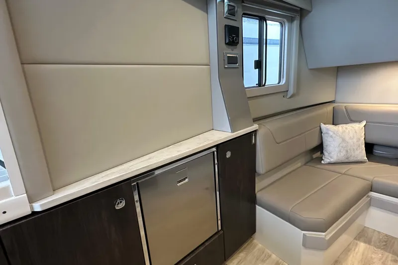 Slide: The Image of 2024 Formula 400 Super Sport Crossover interior with modern seating and sleek cabinetry. - 33