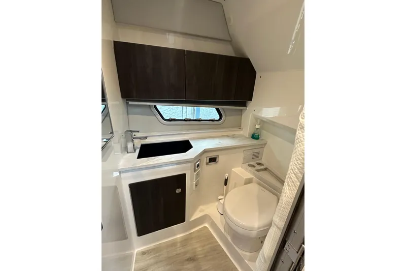 Slide: The Image of 2024 Formula 400 Super Sport Crossover bathroom with modern fixtures and sleek cabinetry. - 35