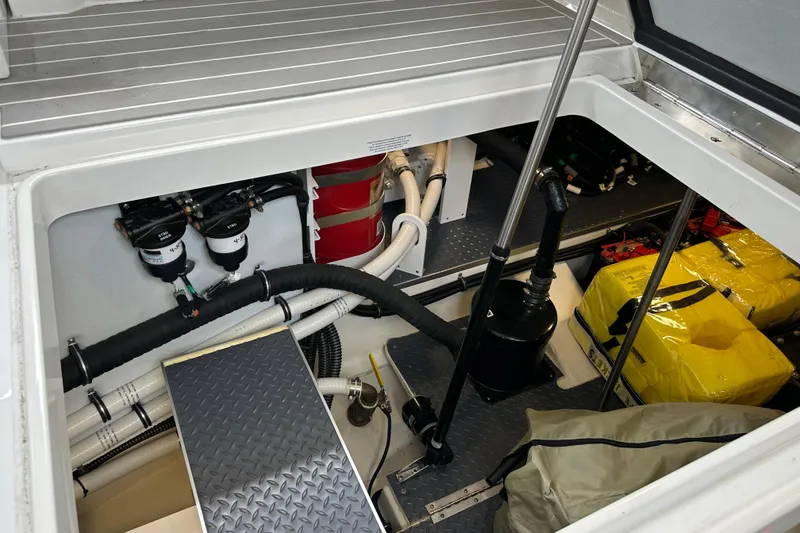 Slide: The Image of Engine compartment of 2024 Formula 400 Super Sport Crossover, showcasing mechanical components and storage. - 37