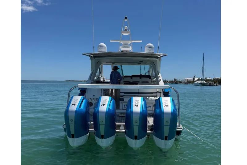 Slide: The Image of 2024 Formula 400 Super Sport Crossover with four outboard engines on calm water. - 4