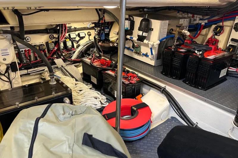 Slide: The Image of Engine room of 2024 Formula 400 Super Sport Crossover with batteries and wiring. - 40