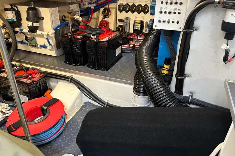 Slide: The Image of Engine room of 2024 Formula 400 Super Sport Crossover with batteries and wiring. - 41