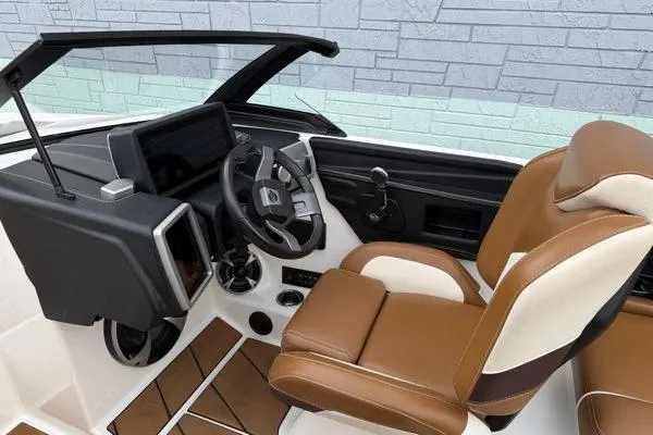 Slide: The Image of 2020 Malibu Wakesetter 21 VLX boat interior with brown and white seating, modern dashboard. - 13