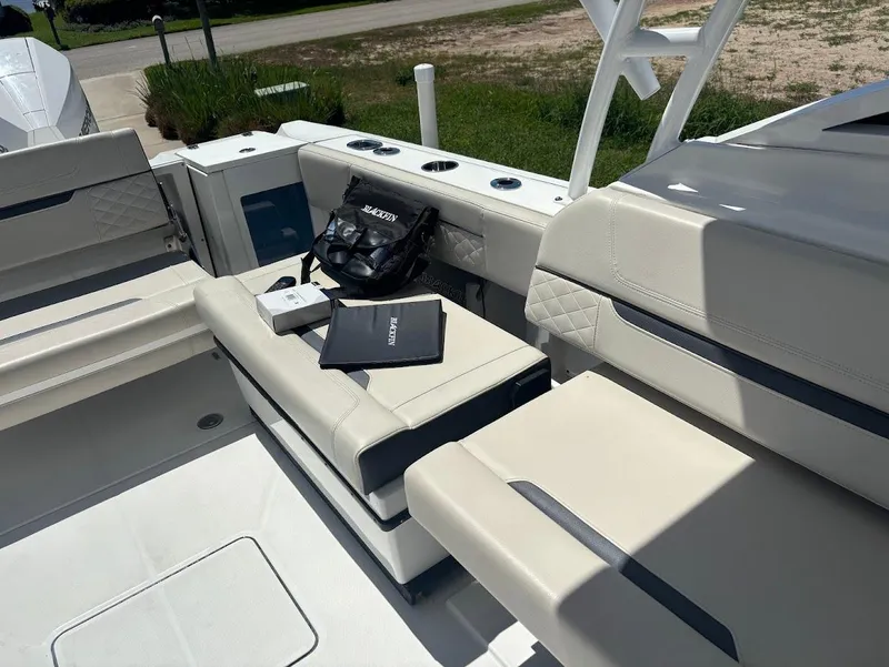 Slide: The Image of Interior of a 2021 Blackfin 272 DC boat with seating. - 11