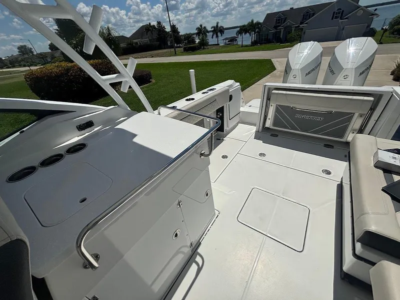 Slide: The Image of Interior view of a 2021 Blackfin 272 DC boat with dual engines. - 13