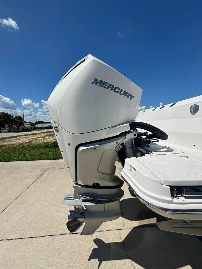 Slide: The Image of 2021 Blackfin 272 DC with Mercury outboard motor, side view. - 20