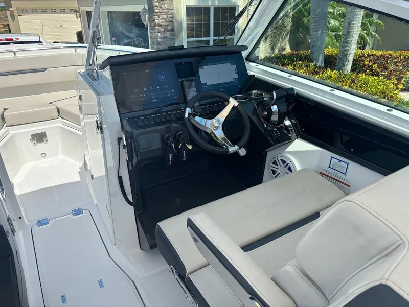 Slide: The Image of Interior of a 2021 Blackfin 272 DC boat with modern helm console. - 7