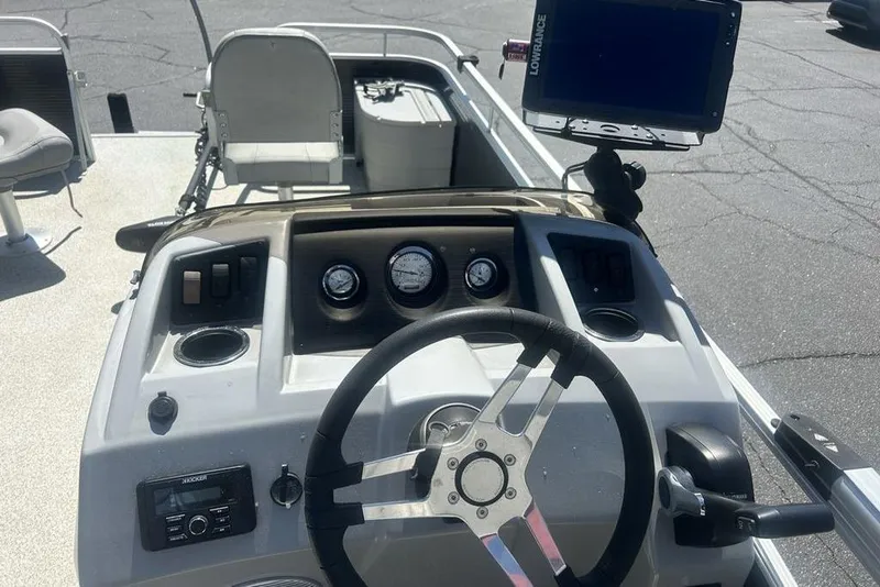 Slide: The Image of 2021 Bennington 20 SFX boat dashboard with steering wheel and navigation equipment. - 13