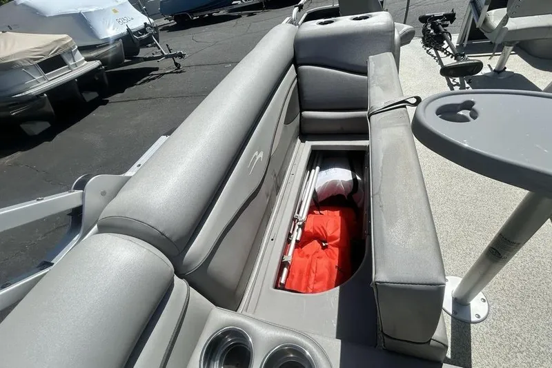 Slide: The Image of 2021 Bennington 20 SFX boat interior with storage compartment and seating. - 17