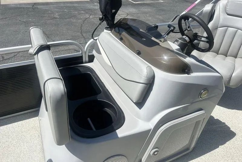 Slide: The Image of 2021 Bennington 20 SFX boat console with steering wheel and seating area. - 8