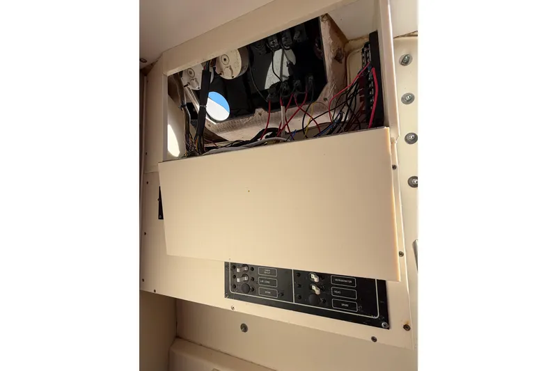 Slide: The Image of Electrical panel and wiring inside a 1996 Grady-White Marlin 300 boat. - 18