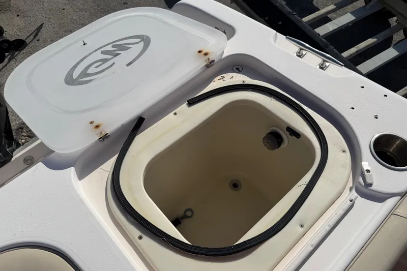 Slide: The Image of Open hatch on 1996 Grady-White Marlin 300 boat, showing storage compartment. - 20