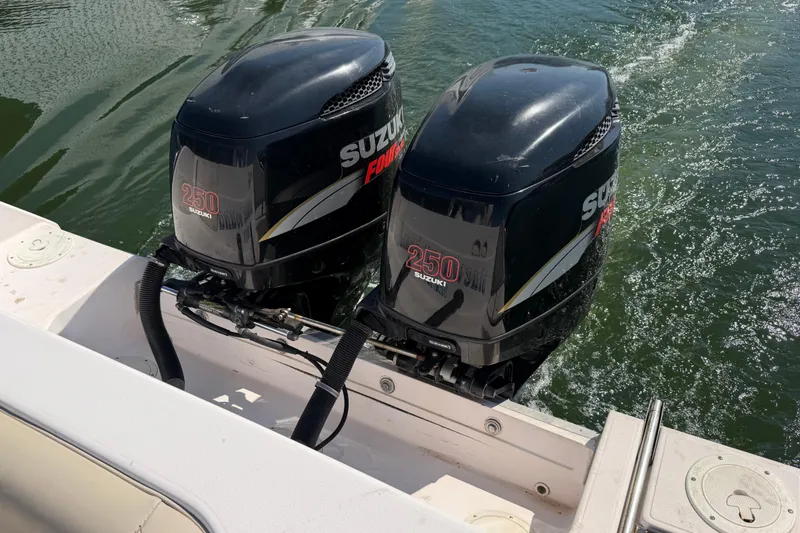 Slide: The Image of Twin Suzuki 250 outboard engines on a 1996 Grady-White Marlin 300 boat. - 6