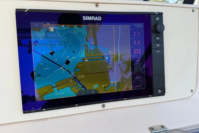 Slide: The Image of Simrad navigation display on 1996 Grady-White Marlin 300 boat dashboard. - 8