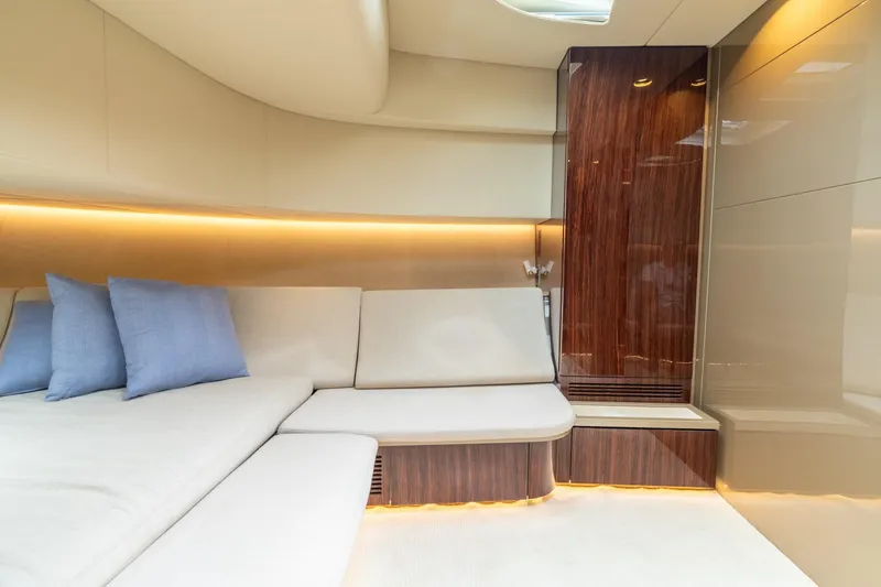 Slide: The Image of Luxurious interior of 2019 CNM Continental 54 yacht with elegant seating and ambient lighting. - 31